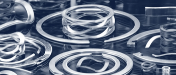 assortment of different types of smalley wave springs and retaining rings